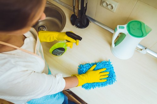 Local carpet cleaning technician using extraction equipment in Clapham